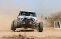 Front view close-up of white Chenowth rally car pull away at road crossing Royalty Free Stock Photo